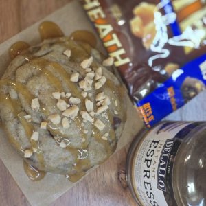 Caramel espresso crunch cookie with caramel drizzle and toffee pieces